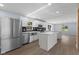 Stylish kitchen with stainless steel appliances, white cabinetry, and an island for food preparation at 4305 Five Points Rd, Indianapolis, IN 46239