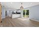 Open-concept kitchen and dining area with an island and stainless appliances at 4305 Five Points Rd, Indianapolis, IN 46239
