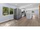 Contemporary kitchen features stainless steel fridge, white cabinets, and a view from the window at 4305 Five Points Rd, Indianapolis, IN 46239