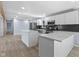 Open kitchen with a spacious island, white cabinets, and stainless steel appliances, perfect for cooking at 4305 Five Points Rd, Indianapolis, IN 46239