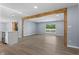 Spacious living room showcasing wood beam architecture, and a view to the front yard at 4305 Five Points Rd, Indianapolis, IN 46239