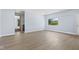 Spacious living room with wood flooring, light gray paint, and natural light at 4305 Five Points Rd, Indianapolis, IN 46239
