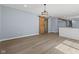 Open-concept living room featuring stylish wood floors and a barn door at 4305 Five Points Rd, Indianapolis, IN 46239