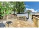 Wooden backyard deck with a modern outdoor seating area and lush greenery at 44 S Tremont St, Indianapolis, IN 46222