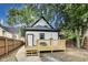 Backyard view of home with wooden deck and partial view of surrounding yard at 44 S Tremont St, Indianapolis, IN 46222