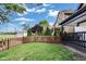 Green backyard area with a manicured lawn, complemented by mature trees and fencing for privacy and outdoor enjoyment at 44 S Tremont St, Indianapolis, IN 46222