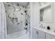 Elegant bathroom with marble-tiled shower, modern fixtures, and a sleek vanity for a spa-like experience at 44 S Tremont St, Indianapolis, IN 46222