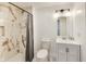 Modern bathroom showcasing a tiled shower, sleek fixtures, and vanity with storage underneath the sink at 44 S Tremont St, Indianapolis, IN 46222
