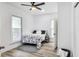 Comfortable bedroom with ample natural light, complemented by a ceiling fan and stylish decor elements at 44 S Tremont St, Indianapolis, IN 46222