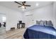 Modern bedroom with a dark blue bed, a desk, and ample closet space, perfect for work or relaxation at 44 S Tremont St, Indianapolis, IN 46222