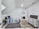 Bedroom with a bed, dresser, and decor. Features sleek floors, bright lighting, and neutral color palette at 44 S Tremont St, Indianapolis, IN 46222