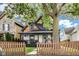 Attractive house with a lovely yard and mature trees, offering a serene and inviting outdoor space at 44 S Tremont St, Indianapolis, IN 46222