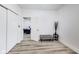 Bright hallway featuring sleek wood floors, a seating bench, and an open doorway to the living room at 44 S Tremont St, Indianapolis, IN 46222