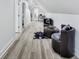 Hallway with a seating area, desk, and views into another room. Bright and spacious at 44 S Tremont St, Indianapolis, IN 46222