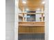 A basement workshop area featuring a wooden workbench with a sink, providing a functional space for projects at 4523 Kingsley Dr, Indianapolis, IN 46205