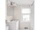 Clean bathroom with white vanity, modern faucet, and window allowing for natural light at 4523 Kingsley Dr, Indianapolis, IN 46205