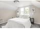 Inviting bedroom featuring large windows, contemporary decor, and cozy lamps for a bright and airy feel at 4523 Kingsley Dr, Indianapolis, IN 46205