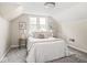 Cozy bedroom featuring plush carpeting, natural light from the windows and modern wall decor at 4523 Kingsley Dr, Indianapolis, IN 46205