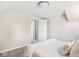 Bright bedroom with neutral tones, closet, and an open doorway to an adjoining space creating an airy feel at 4523 Kingsley Dr, Indianapolis, IN 46205