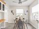 Dining area with a ceiling fan and light, centered on a wooden table with four chairs at 4523 Kingsley Dr, Indianapolis, IN 46205