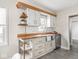 Kitchen with stainless steel appliances, white cabinets, butcher block counters, and storage at 4523 Kingsley Dr, Indianapolis, IN 46205