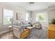 Inviting living room with plush seating, rug, and natural light creating a relaxing atmosphere at 4523 Kingsley Dr, Indianapolis, IN 46205