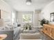 Spacious living room showcasing the furniture layout, natural lighting, and decor elements at 4523 Kingsley Dr, Indianapolis, IN 46205