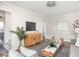 Stylishly decorated living room featuring a wooden cabinet, hardwood floors, and comfortable seating at 4523 Kingsley Dr, Indianapolis, IN 46205