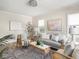 Bright living room featuring stylish decor, hardwood floors, and comfortable seating at 4523 Kingsley Dr, Indianapolis, IN 46205