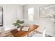 Bright office space featuring a desk, window, art, and view of adjacent room at 4523 Kingsley Dr, Indianapolis, IN 46205