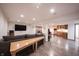Finished basement boasts a full kitchenette, ample living space, and recessed lighting at 4976 Rockne Cir, Carmel, IN 46033