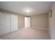Bedroom with neutral walls, plush carpeting, and a double closet with sliding doors at 4976 Rockne Cir, Carmel, IN 46033