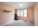 Bedroom with peach paint, carpet and equipped with simple furnishings and natural light at 4976 Rockne Cir, Carmel, IN 46033