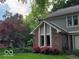 Exterior facade of a home with mature trees and landscaping featuring a red maple at 4976 Rockne Cir, Carmel, IN 46033