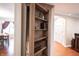 Intriguing hidden bookshelf with beautiful finish; opens into another room at 4976 Rockne Cir, Carmel, IN 46033