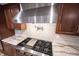 Well-equipped kitchen boasts a professional-grade stove, stylish backsplash, and modern fixtures at 4976 Rockne Cir, Carmel, IN 46033