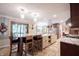 Bright and airy kitchen featuring an island with seating, lots of counter space and modern lighting at 4976 Rockne Cir, Carmel, IN 46033