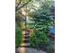 Landscaped backyard featuring flagstone pathway and mature flowering trees and shrubs at 4976 Rockne Cir, Carmel, IN 46033