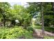 Landscaped backyard featuring lush greenery and a tranquil hammock, creating a peaceful retreat at 4976 Rockne Cir, Carmel, IN 46033