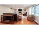 Comfortable living room features a fireplace, built-in shelving, and hardwood floors at 4976 Rockne Cir, Carmel, IN 46033