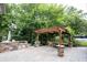 Entertainer's patio with outdoor kitchen and shaded pergola, great for gatherings at 4976 Rockne Cir, Carmel, IN 46033