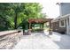 Spacious outdoor kitchen and patio with pergola, perfect for outdoor dining and relaxation at 4976 Rockne Cir, Carmel, IN 46033