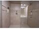 Beautiful shower with tile surround, rainfall showerhead, and built-in niche at 4976 Rockne Cir, Carmel, IN 46033