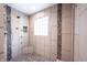 Tiled shower with mosaic accents, multiple showerheads, and a built-in corner seat at 4976 Rockne Cir, Carmel, IN 46033