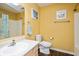 Bright bathroom with a shower/tub, patterned shower curtain, and yellow paint at 5642 Southern Mist Dr, Indianapolis, IN 46237