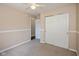 Bedroom featuring carpeted floors, ceiling fan, closet for storage, and an adjacent room at 5642 Southern Mist Dr, Indianapolis, IN 46237