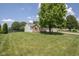 Exterior view of a house on a large lot, showcasing ample lawn space at 5642 Southern Mist Dr, Indianapolis, IN 46237