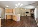 Open-concept kitchen and living area with wood floors, perfect for entertaining guests at 5642 Southern Mist Dr, Indianapolis, IN 46237
