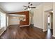 Open-concept living space featuring wood floors, with the kitchen visible in the background at 5642 Southern Mist Dr, Indianapolis, IN 46237