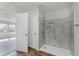 Bathroom featuring modern tiled shower with a built-in niche and accessible fixtures at 5672 High Timber Ln, Indianapolis, IN 46235